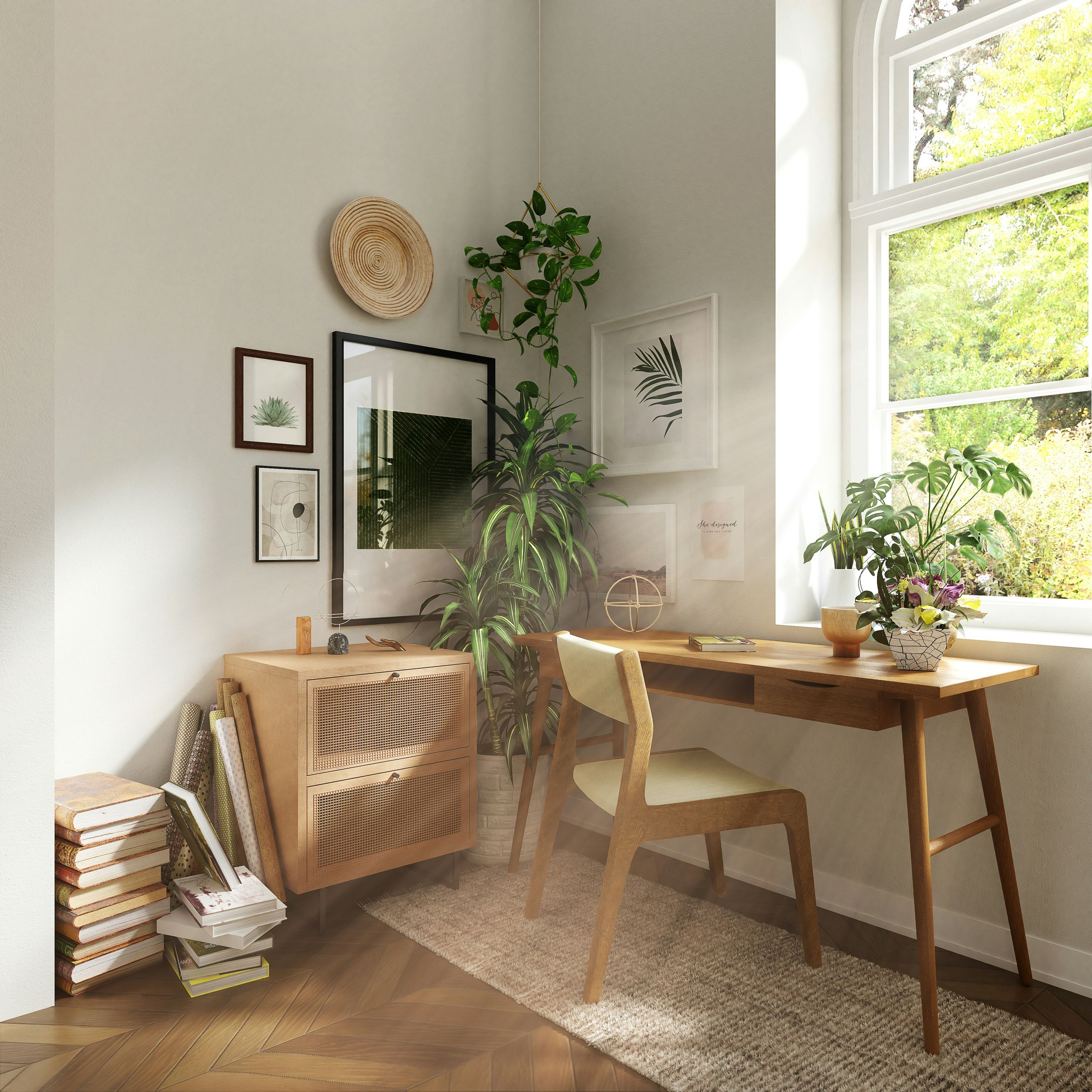 Sunlit home office corner in The Lodges at Fort Mill, featuring a wooden desk, chair, indoor plants, a small cabinet, books, and framed wall art.